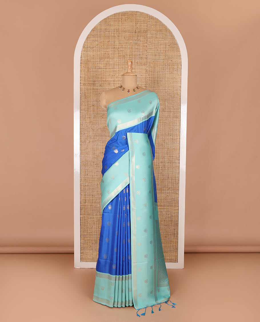 Blue zari buttas soft silk saree, contrast zari border of intricate designs, zari-rich jaal pallu, and a contrast zari design blouse