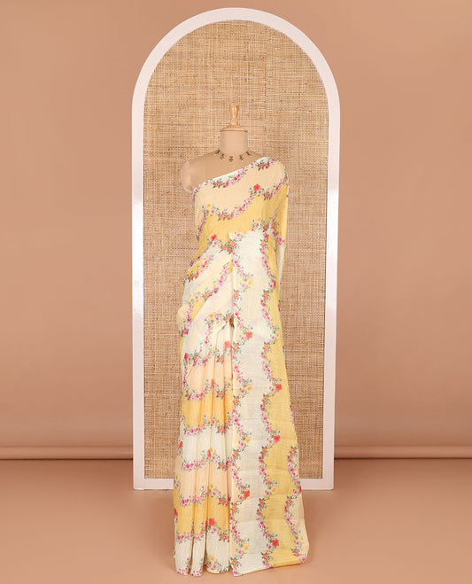 Borderless yellow rangkat style dyed and floral printed linen cotton saree with a contrast printed blouse