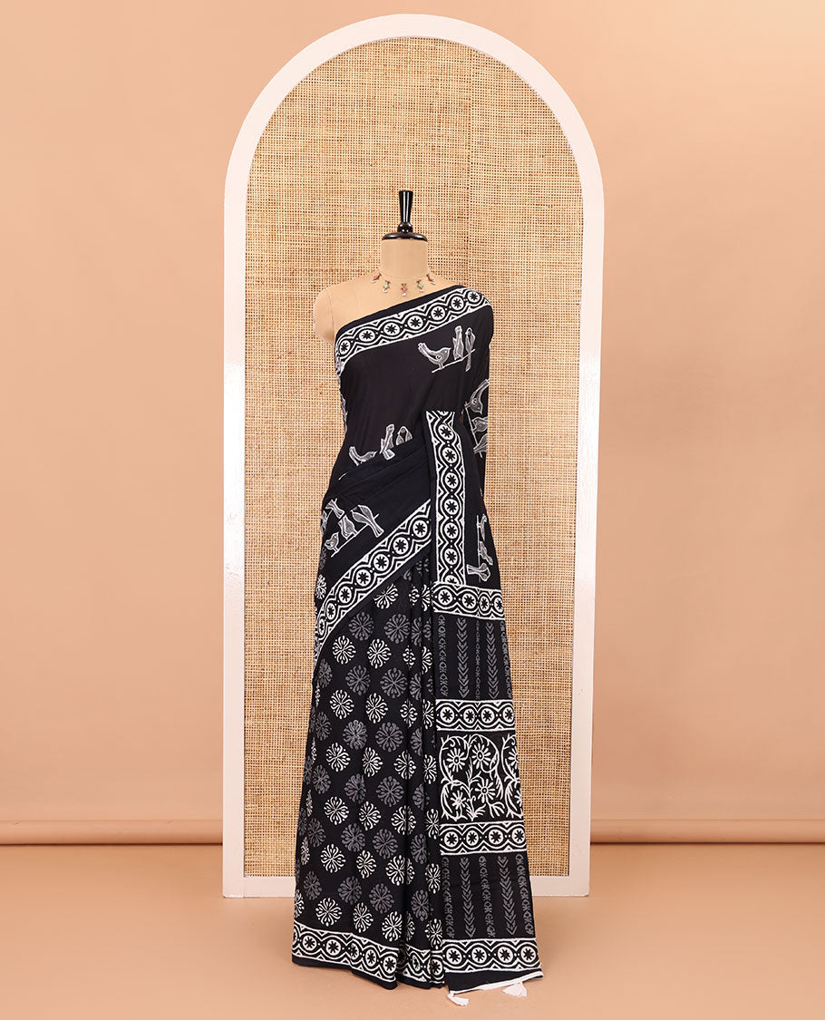 Black sparrow motifs hand block printed soft mul cotton, block printed border, pallu of floral-geometric print, and a hand block printed blouse