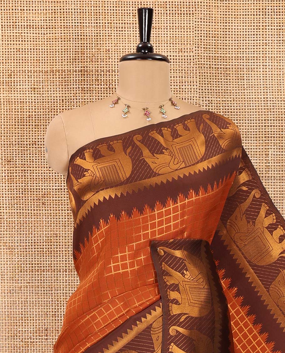 Rust orange-brown zari checked kanchi silk saree, contrast elephant motifs zari border, traditional zari design pallu, and a jacquard blouse