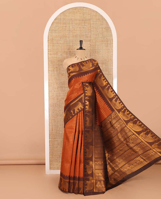 Rust orange-brown zari checked kanchi silk saree, contrast elephant motifs zari border, traditional zari design pallu, and a jacquard blouse