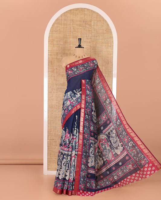 Navy blue kalamkari ancient human figurines machine-printed muslin cotton saree, contrast traditional design zari border, kalamkari printed pallu, and contrast floral motifs and zari bordered blouse