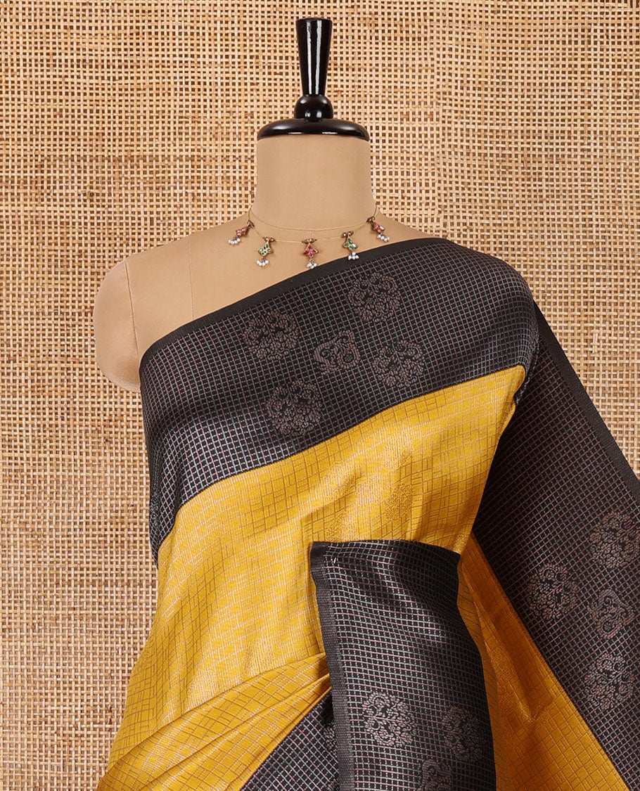 Yellow zari buttas and checked kanchi silk saree, contrast border of zari buttas, and checks, intricate pallu, and contrast zari bordered blouse