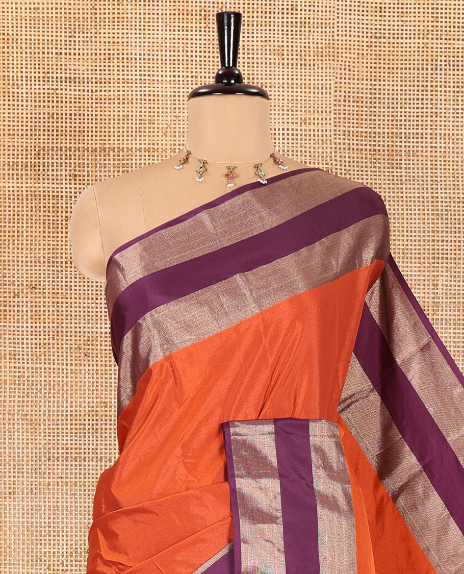 Rust orange plain semi-soft silk saree, contrast satin with copper zari border,  striped pallu, and a plain blouse