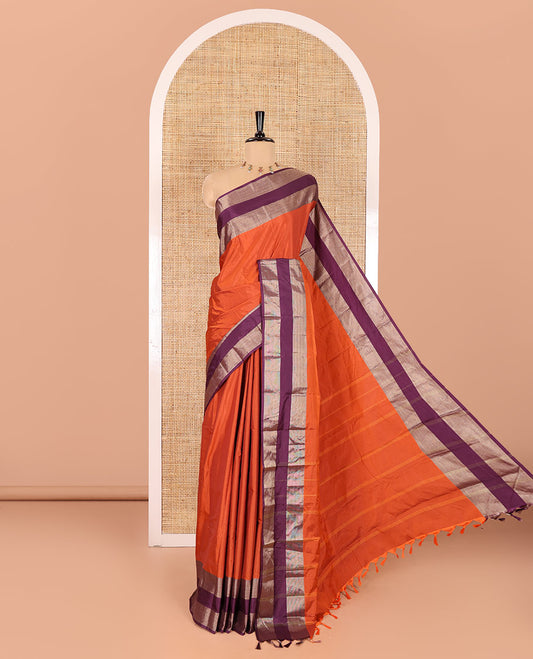 Rust orange plain semi-soft silk saree, contrast satin with copper zari border,  striped pallu, and a plain blouse