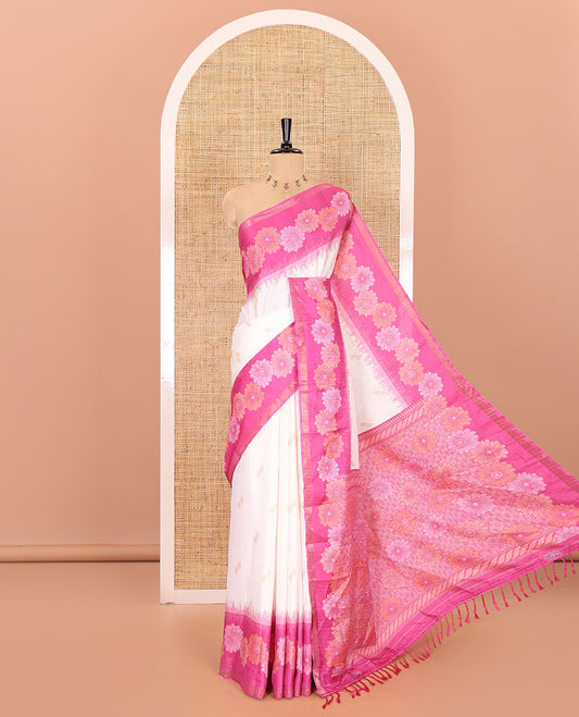 Half-white floral buttas katan silk saree, contrast floral motifs border, pallu adorned with floral designs, and a contrast lotus flower printed blouse