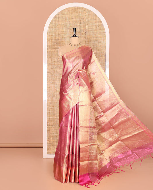Rani Pink Tissue Saree Features Floral Jacquard Design Woven All Over Its Body, Features a Contrast Gleaming Zari Traditional Design Border, Zari-Enriched Pallu, and a Matching Blouse