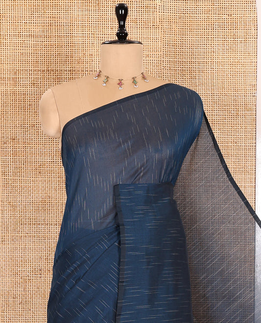Borderless Blue Khadi Mul Cotton Saree Decked with Jharna-Style Waterdrop Motifs, Featuring a Gleaming Zari-Woven Pallu, Paired with a Matching Blouse Replicating the Body Motifs