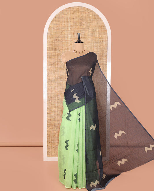 Borderless Parrot Green Linen Cotton Saree, Creatively Printed with Zig-Zag Geometric Motifs, Pallu Mirrors the Same Motifs, and Paired with a Contrast-Printed Blouse