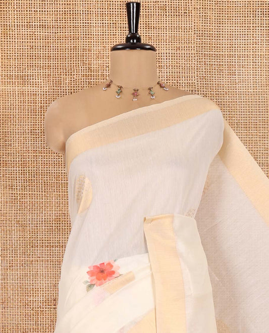 Cream Banaras Tissue Saree, Decked Up with Floral Motifs Print and Zari Buttas on Its Body, Subtle Bavanji Border, Pallu Pictures Floral Prints, and Paired with a Matching Floral Printed Blouse
