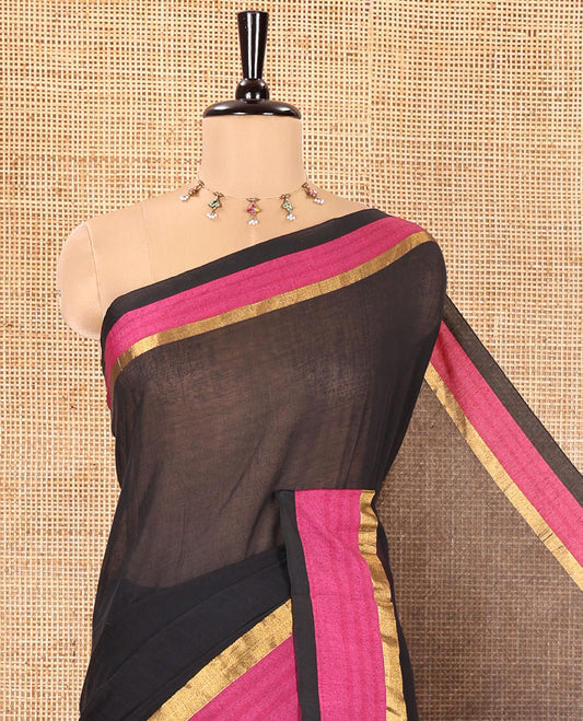 Black Plain Khadi Mul Cotton Saree, Complemented by a Contrast Pink Zari Border, Plain Pallu, and Paired with a Matching Blouse