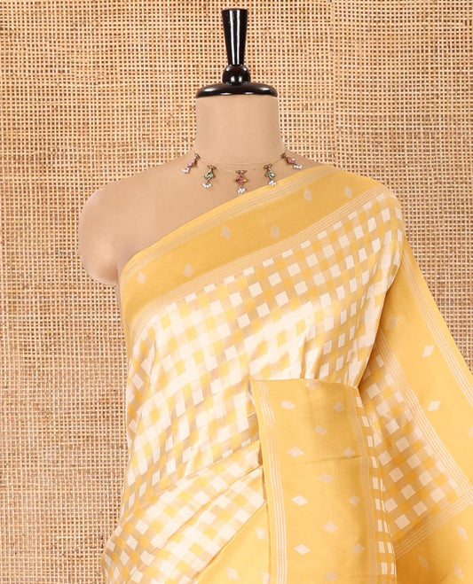 Yellow Kanchi Silk Saree, Elevated with Checked Design on Its Body, Highlighted by a Self-Border of Diamond Patterns, Pallu Steeped with Buttas, and Paired with a Matching Blouse