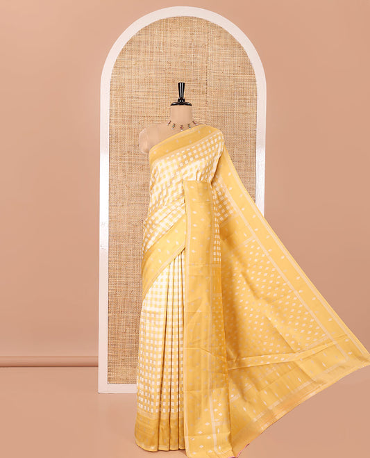 Yellow Kanchi Silk Saree, Elevated with Checked Design on Its Body, Highlighted by a Self-Border of Diamond Patterns, Pallu Steeped with Buttas, and Paired with a Matching Blouse