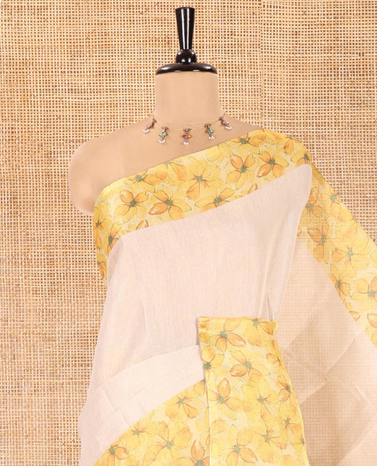 Cream Plain Tissue Saree, Artfully Designed with Contrast Floral Printed Border, Pallu Steeped with Flower Motifs Print, and Paired with a Contrast Blouse