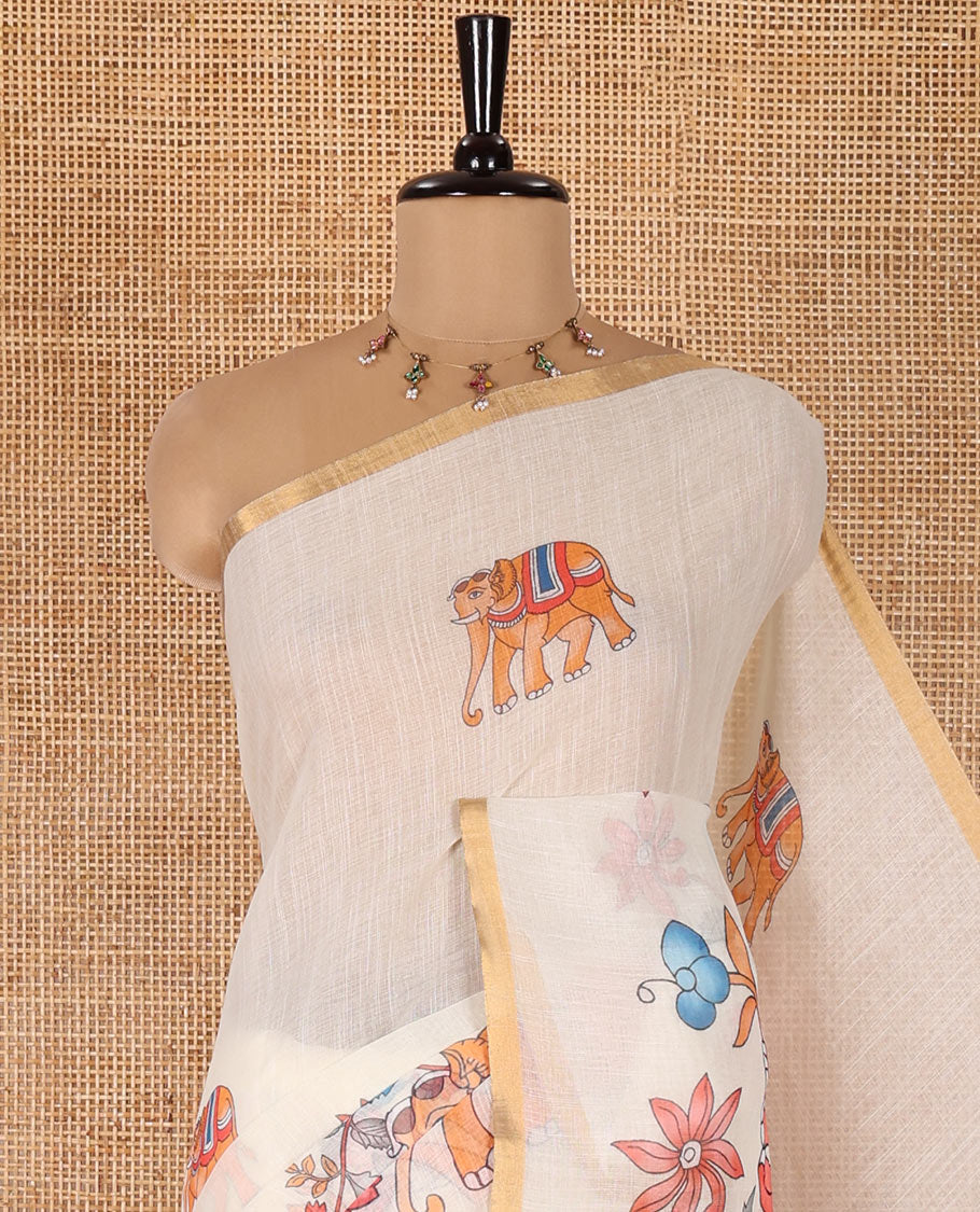 Cream Linen Cotton Saree, Bedecked with Elephant Motifs Printed on Its Body, Subtle Piping Border, Pallu of Floral and Elephant Designs, and Paired with a Matching Blouse