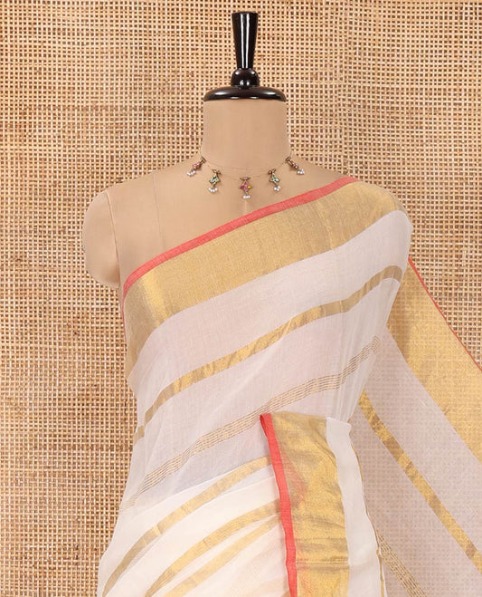 Cream Khadi Mul Cotton Saree, Gleamed up with Zari Stripes All Over Its Body, Subtle Gold Zari Border, Self-Pallu with Tassels, and Paired with a Matching Blouse