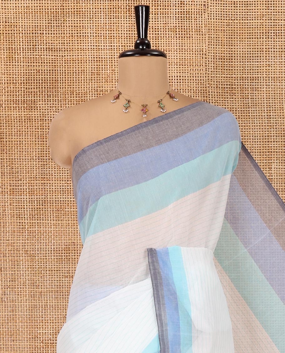 White and Blue Chettinad Cotton Saree, Subtly Sparkled with Stripes All Over Its Body, Complemented by a Contrast Tri-Colored Striped Border, Pallu of Stripes, and Has No Blouse