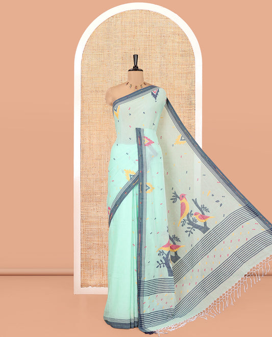 Sea Green Khadi Mul Cotton Saree, Decked Up with Meena Buttas All Over Its Body, Complemented by a Contrast Temple Border, Pallu of Jhamdani-Style Floral-Bird Weaving, and Paired with a Matching Blouse