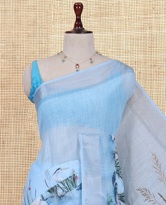 Blue Linen Cotton Saree, Accentuated with a Bird Print, a Subtle Zari Border, and a Matching Blouse