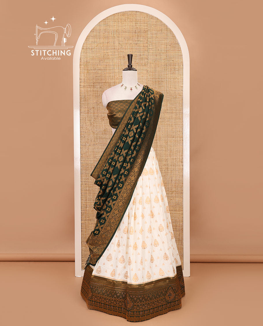 Cream georgette crepe half saree,zari buttas & traditional Swarovski stonework bottle green border skirt, jacquard blouse & banarasi jacquard dhavani