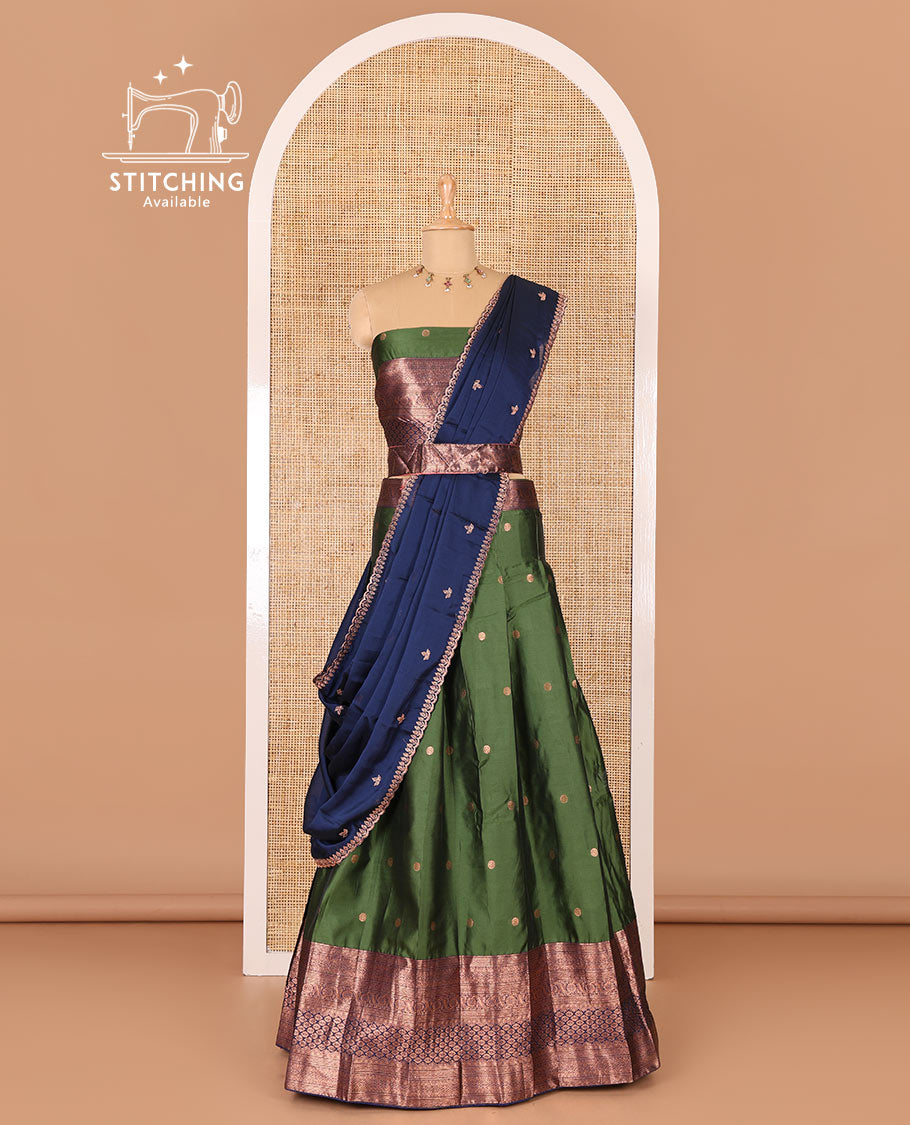 Green taffeta silk half-saree, flower zari buttas and contrast traditional zari bordered skirt, a matching blouse, and contrast embroidered satin georgette scallop dhavani