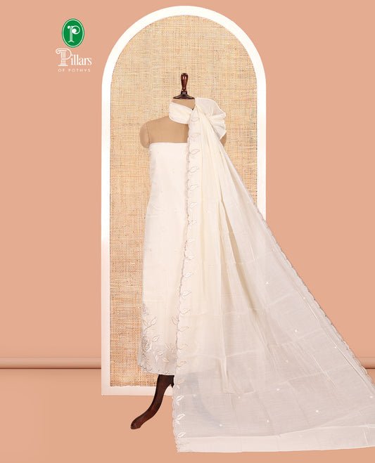 Cream Mul Chanderi Material Churidar Features a Floral Outline Embroidered Top, a Santoon Bottom, a Scallop Threadwork Dupatta