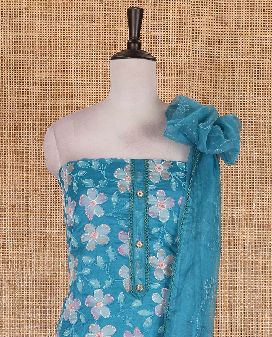 Blue churidar material set, floral print with thread outlined organza top, plain santoon bottom, and floral vine sequins embroidered organza dupatta