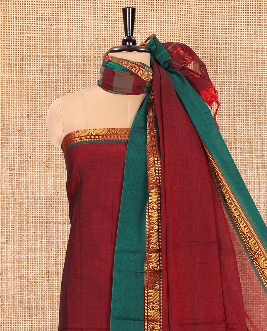 Maroon Plain Mercerised Cotton Material Churidar Set, Complemented by Contrast Elephant Motifs Woven Zari Border, Comes with a Plain Mercerised Cotton Bottom, and Is Paired with a Matching Mercerised Cotton Dupatta Mirroring the Same Design