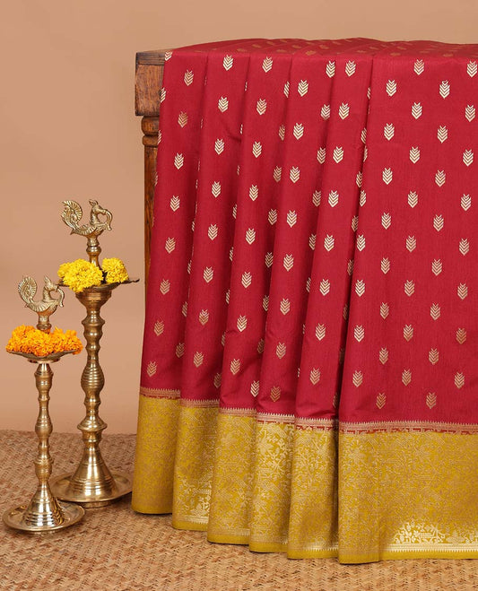 Maroon geometrical butta dola raw silk with contrast kalakshetra zari border & diamond rich pallu along with plain, peacock butta blouse