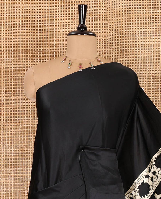 Chikku-black half-and-half plain and kalamkari floral printed satin crepe saree, plain border, pallu of floral vine and peacock printed, and kalamkari floral printed blouse