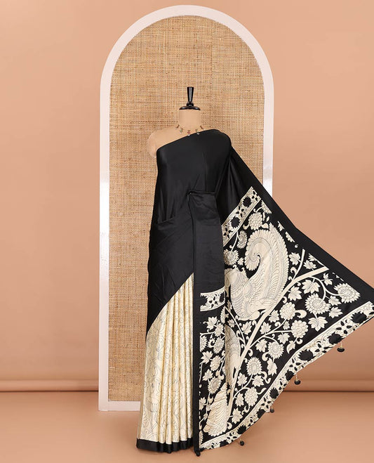 Chikku-black half-and-half plain and kalamkari floral printed satin crepe saree, plain border, pallu of floral vine and peacock printed, and kalamkari floral printed blouse