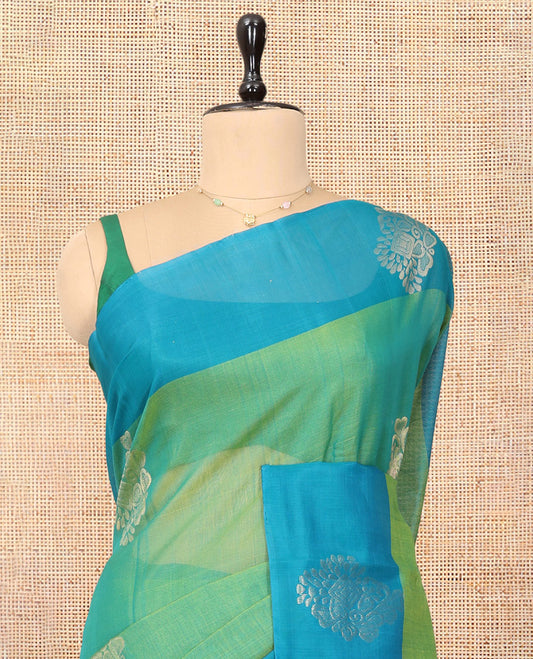 Green Cotton Saree, Accentuated with Zari Buttas, a Contrast Zari Butta Border, a Geometric Pallu, and a Contrast Blouse