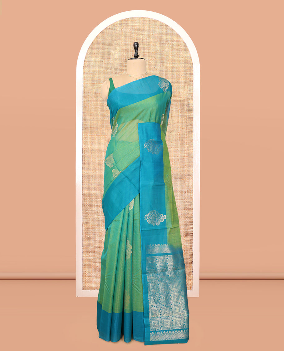 Green Cotton Saree, Accentuated with Zari Buttas, a Contrast Zari Butta Border, a Geometric Pallu, and a Contrast Blouse