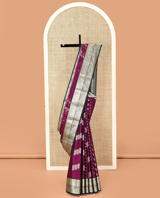 Purple geometric buttas soft silk saree, contrast traditional zari design border, and pallu of chevron designs