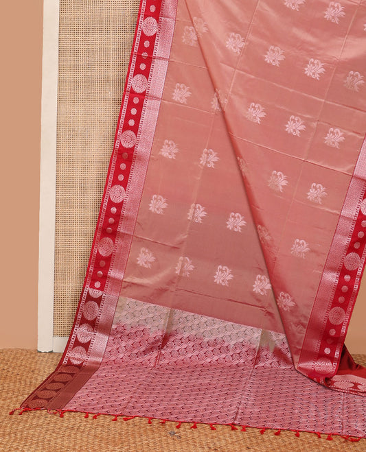 Peach semi-soft silk saree with zari buttas, contrast zari border & pallu steeped with spiral motifs