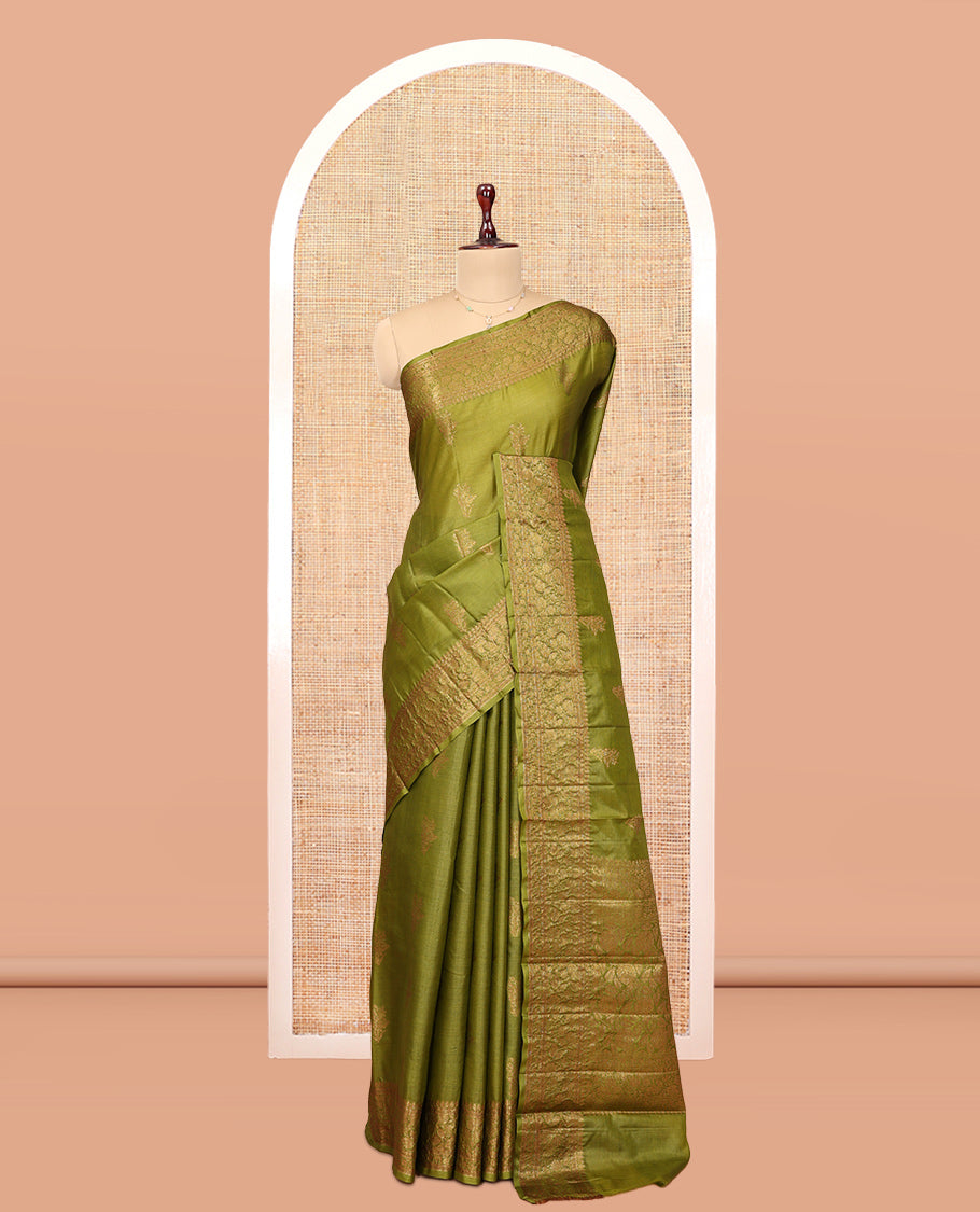 Green Tussar Silk Saree Features Zari Buttas, Highlighted by a Zari Border, Intricately Designed Pallu, and a Matching Blouse