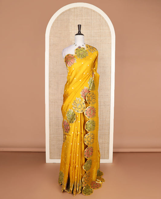 Yellow Matka silk saree features rudraksham motifs, scallop floral motifs and bird embossed thread embroidery border