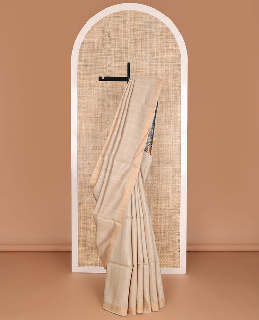 Sandal plain design tussar saree, zari border & contrast pallu of patola-style elephant motifs print