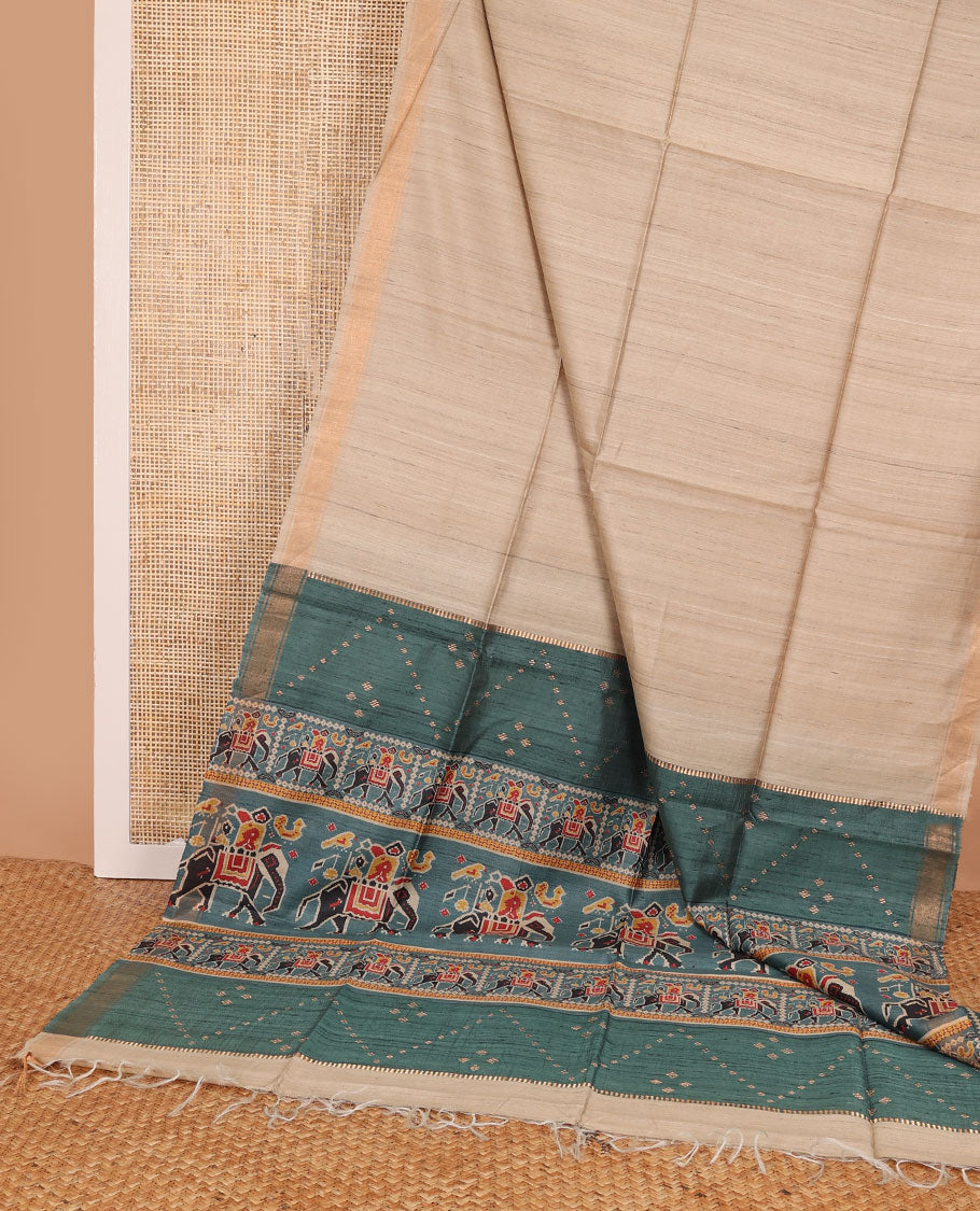 Sandal plain design tussar saree, zari border & contrast pallu of patola-style elephant motifs print
