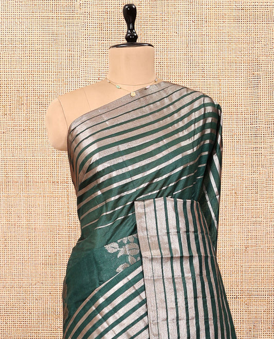 Borderless Green Tussar Silk Saree, Impeccably Styled with Zari Stripes and Floral Buttas, Striped Pallu, and a Matching Blouse