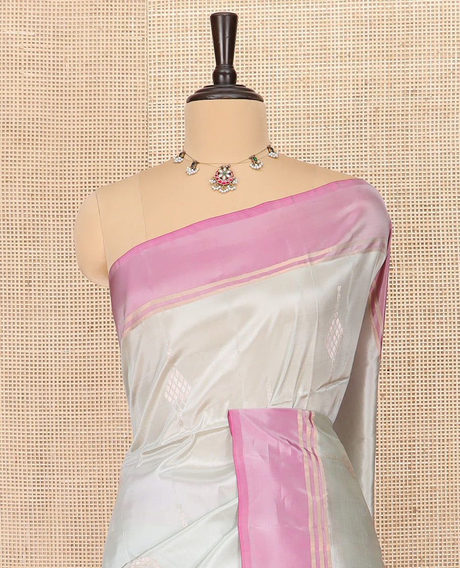 Grey Semi Uppada Saree Embellished with Zari Buttas, Complemented by a Contrast Bavanji Border, Pallu Elevated with Intricate Zari Designs, and Paired with a Contrast Blouse