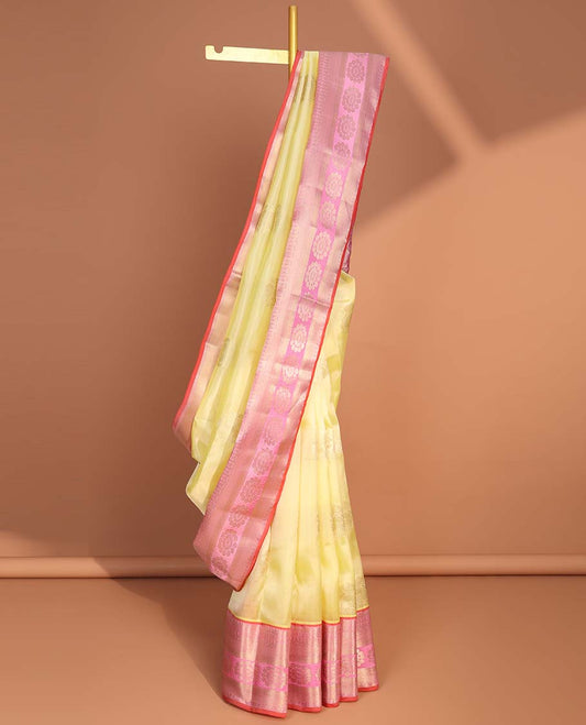 Light yellow floral buttas vasundhara elite silk saree with contrast traditional zari design border & floral enclosed checked design pallu