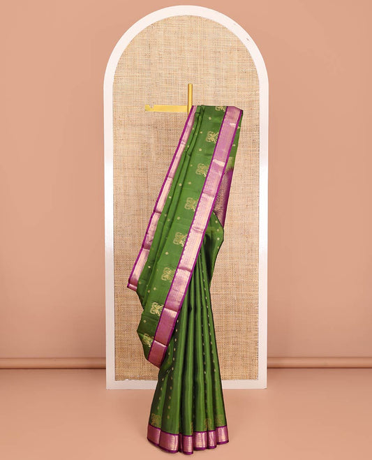 Green Vasundhara Lite-Silk Mix Saree Embellished with Zari Buttas on Its Body, Complemented by a Contrast Border of Thazampoo Rekku, Rettai Neli, Jada Nagam, and Mayil Kann Designs, Gleaming Zari Pallu of Jaal Designs, and Paired with a Contrast Blouse