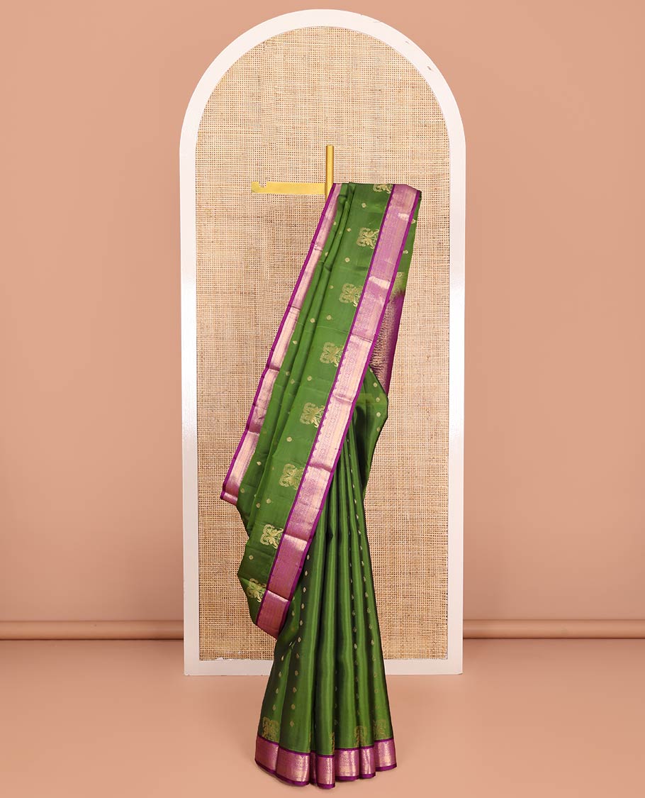 Green Vasundhara Lite-Silk Mix Saree Embellished with Zari Buttas on Its Body, Complemented by a Contrast Border of Thazampoo Rekku, Rettai Neli, Jada Nagam, and Mayil Kann Designs, Gleaming Zari Pallu of Jaal Designs, and Paired with a Contrast Blouse