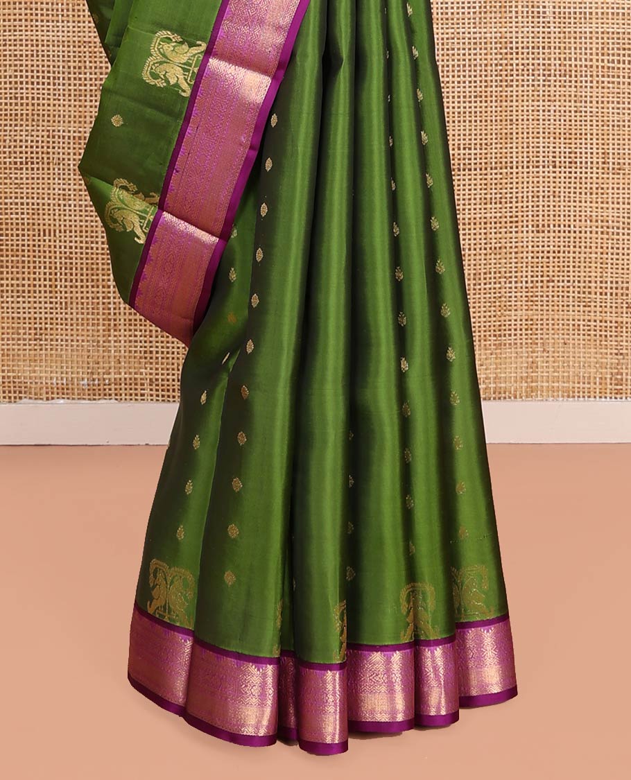 Green Vasundhara Lite-Silk Mix Saree Embellished with Zari Buttas on Its Body, Complemented by a Contrast Border of Thazampoo Rekku, Rettai Neli, Jada Nagam, and Mayil Kann Designs, Gleaming Zari Pallu of Jaal Designs, and Paired with a Contrast Blouse