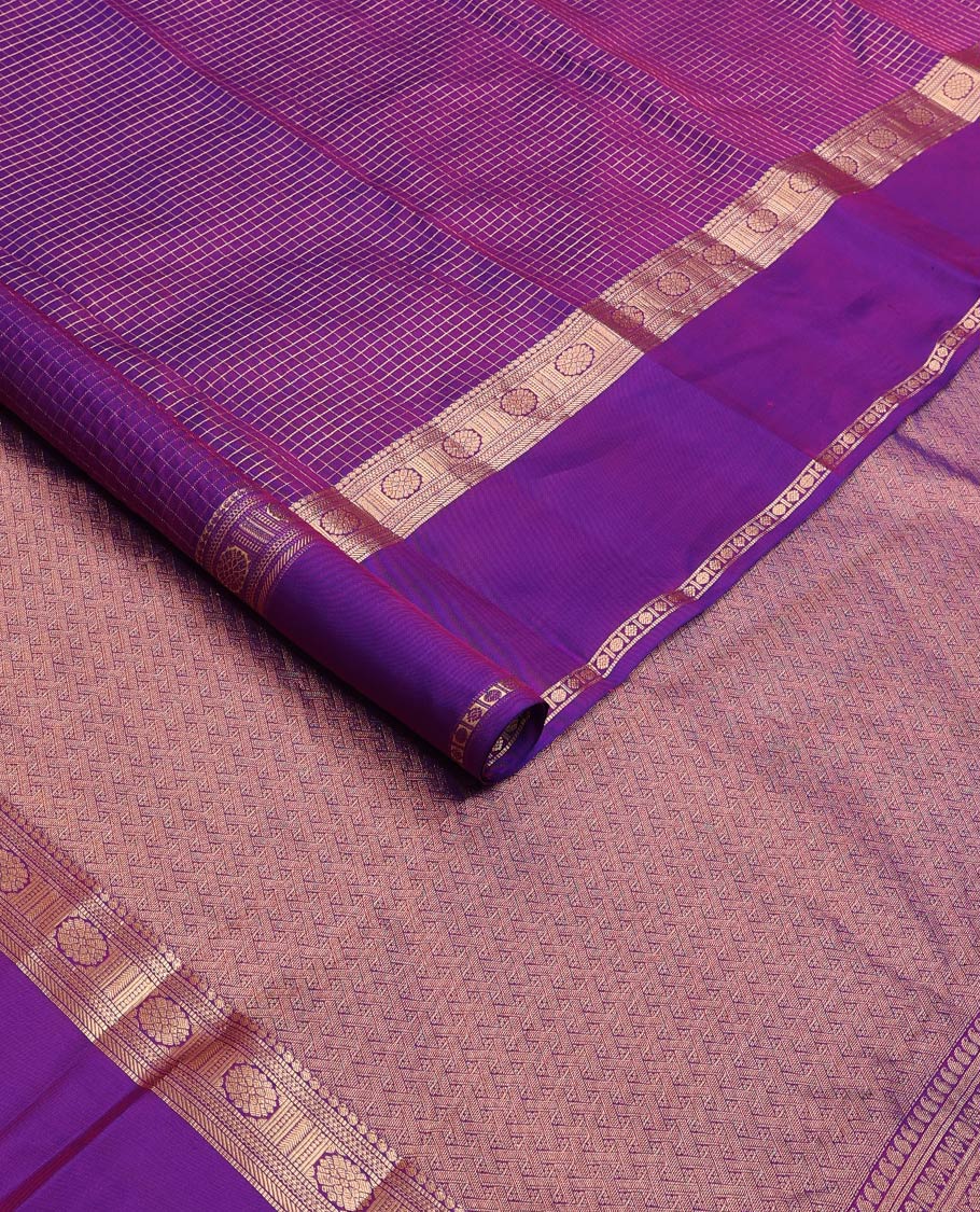 Purple zari checked Vasundhara silk mix saree, zari rettai pettu border of manga, muthu, banaras, and laddu kamalam designs, and intricate pallu