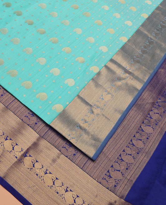 Blue Vasundhara Lite Silk Mix Saree Accentuated with Manga Buttas, Featuring a Contrast Border of Muthu, Kathir, Banaras, Manga, and Mayil Designs, Pallu Steeped with Traditional Zari Designs, and Has a Contrast Blouse