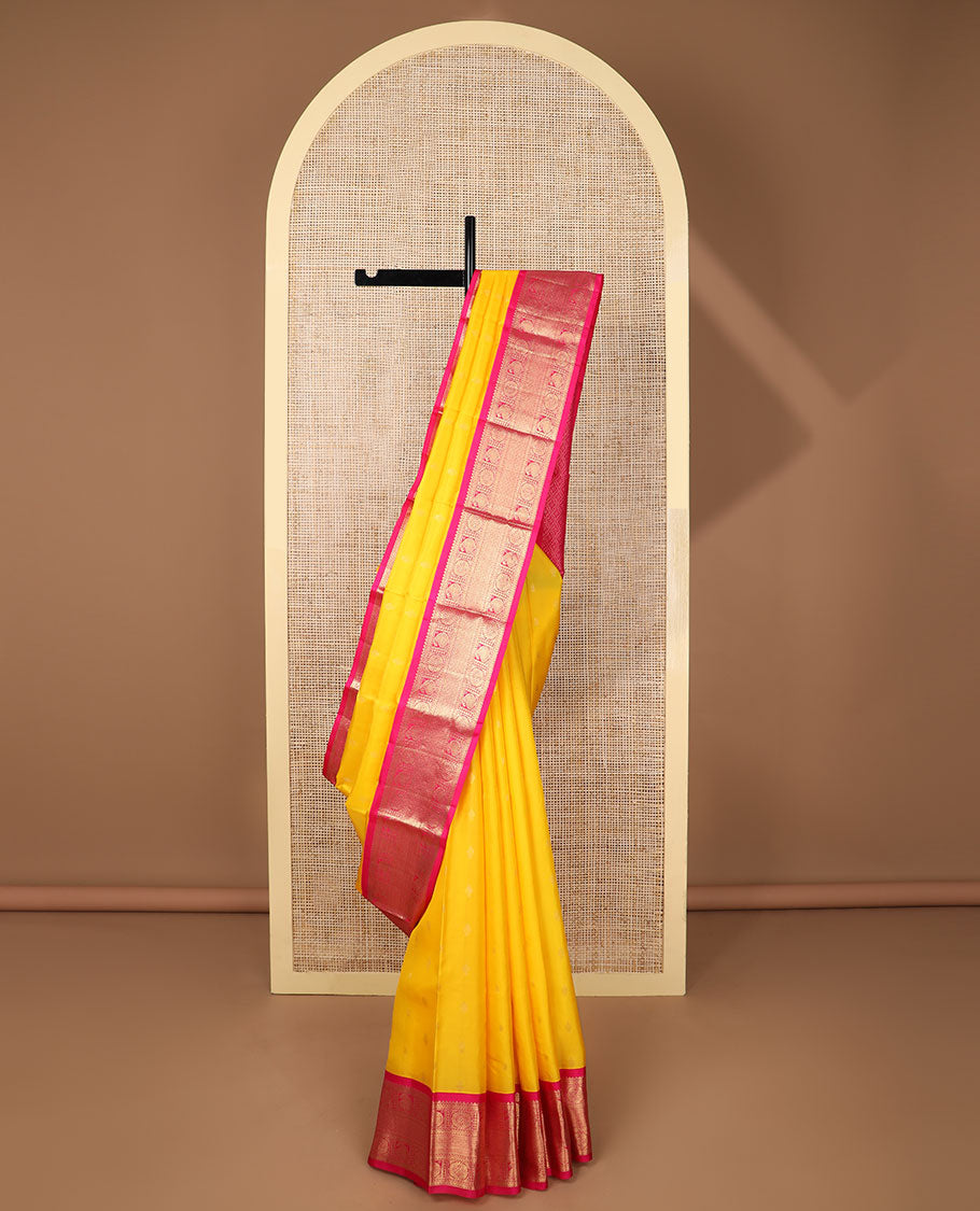 Yellow butta silk saree with contrast korvai zari design border & intricate zari design pallu