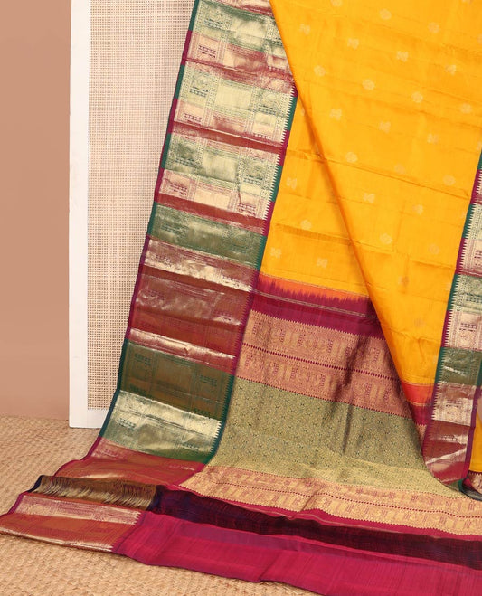 Orange buttas silk saree with contrast rekku, muthu, banaras, mayil design & floral design pallu
