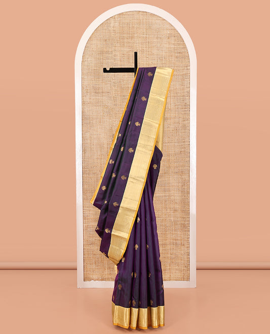 Purple Vasundhara Silk Saree, Elevated with Iruthakshi Buttas All Over Its Body, Complemented by a Contrast Border of Rekku, Then Kuli Kann, and Kodi Visiry Designs, Grand Jaal Pallu, and Paired with a Contrast Blouse